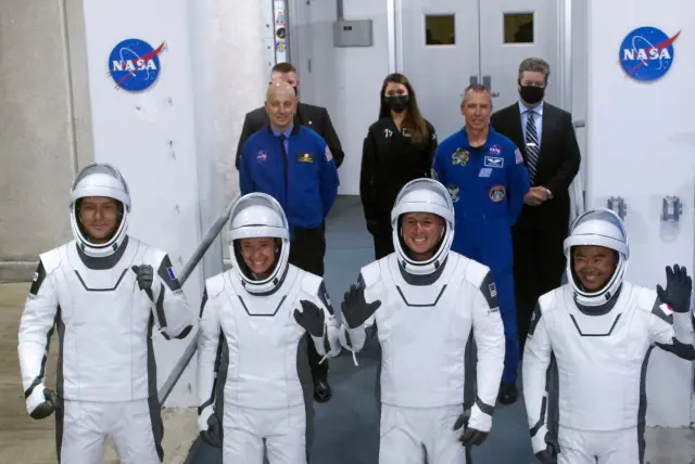 Four astronauts leave the ISS for a return journey to earth