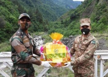Indian and Pakistani soldiers exchange sweets on Diwali along the border