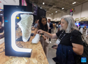 On june 18, 2024, an attendee explores a booth at the collision conference in toronto, canada. This annual technology event runs from june 17 to june 20, drawing an estimated 37,000 participants from across the globe.